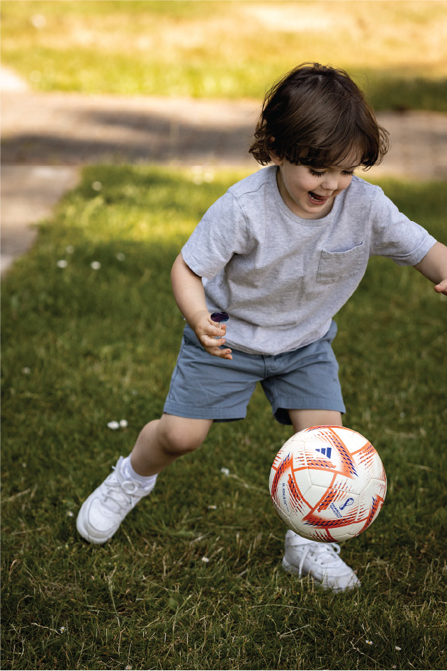 Kid kicking with soccer ball
